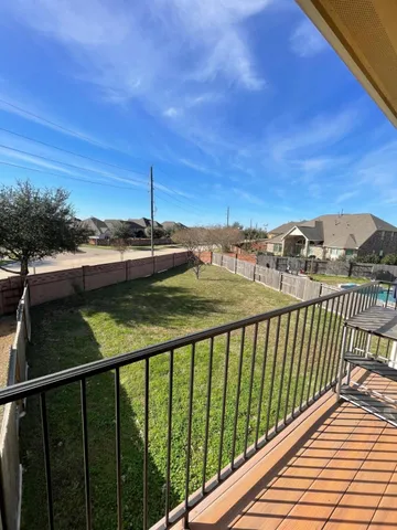 a view of a balcony with an outdoor space