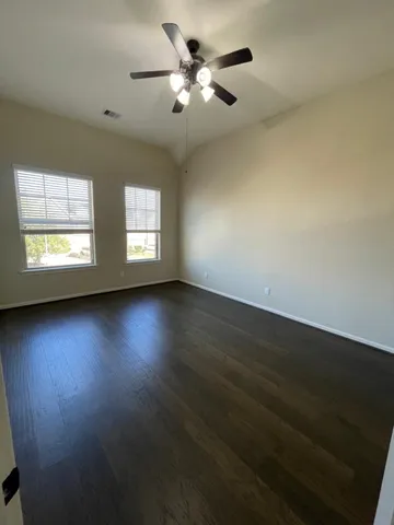 a view of room window and wooden floor