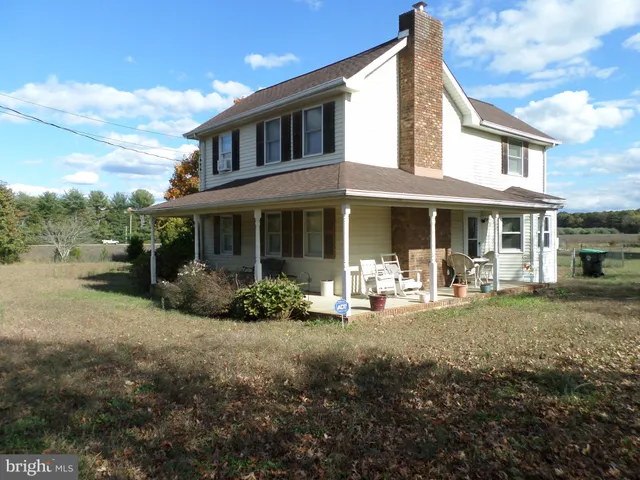a front view of a house with outdoor seating yard