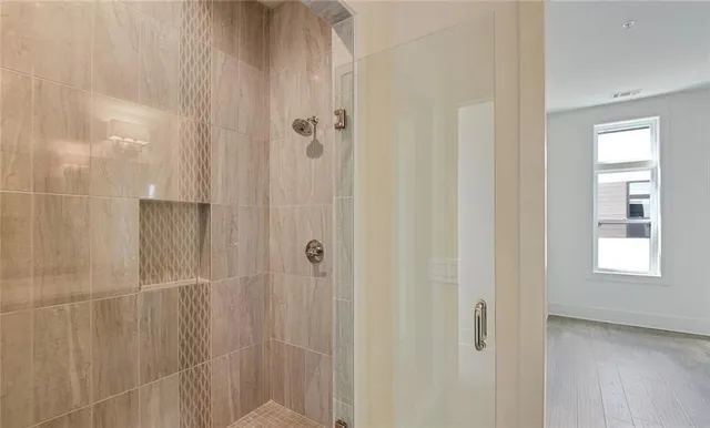 a view of an entryway with wooden floor