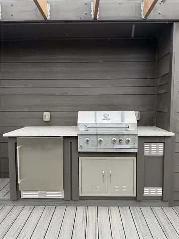 a stove top oven sitting inside of a kitchen