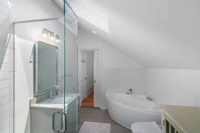 a bathroom with a sink and mirror