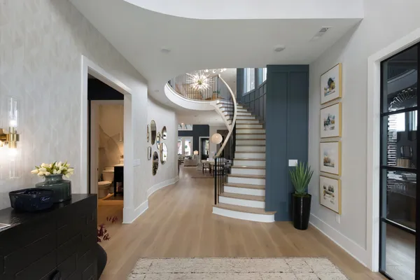 a living room with furniture and a entryway