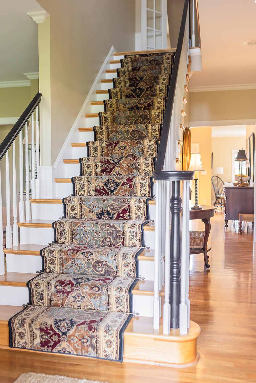6395 Delaney Ferry Road Versailles, KY 40383 - Photo 5 of 52 Welcoming entryway showcasing beautiful hardwood floors and a striking staircase, creating an elegant first impression.