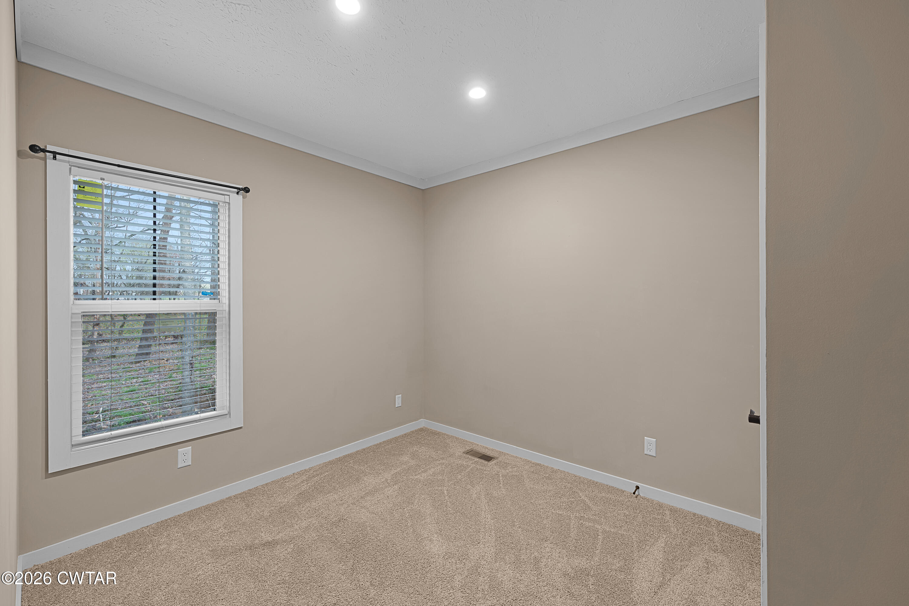 461 Humboldt Gibson Wells Road Humboldt, TN 38343 - Photo 14 of 24 an empty room with a window