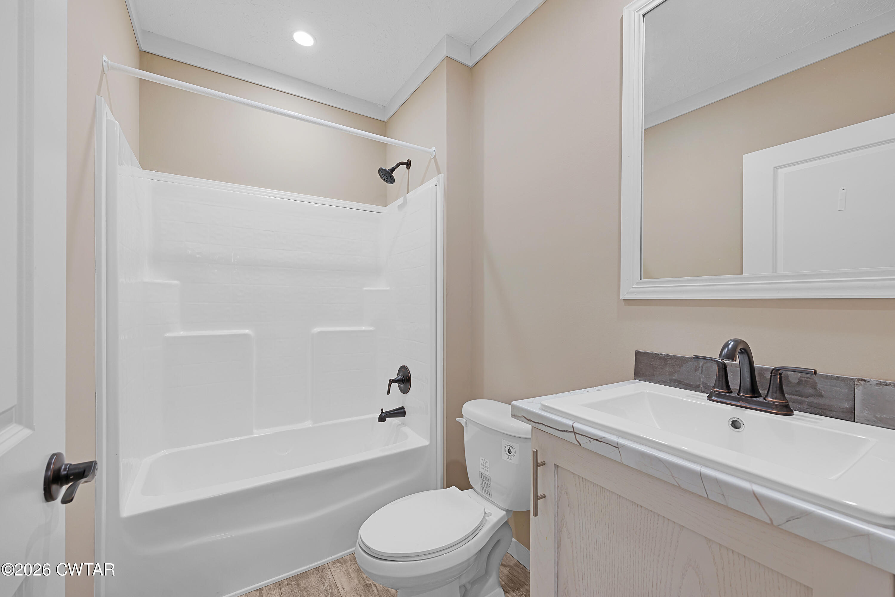 461 Humboldt Gibson Wells Road Humboldt, TN 38343 - Photo 15 of 24 a bathroom with a sink toilet and shower