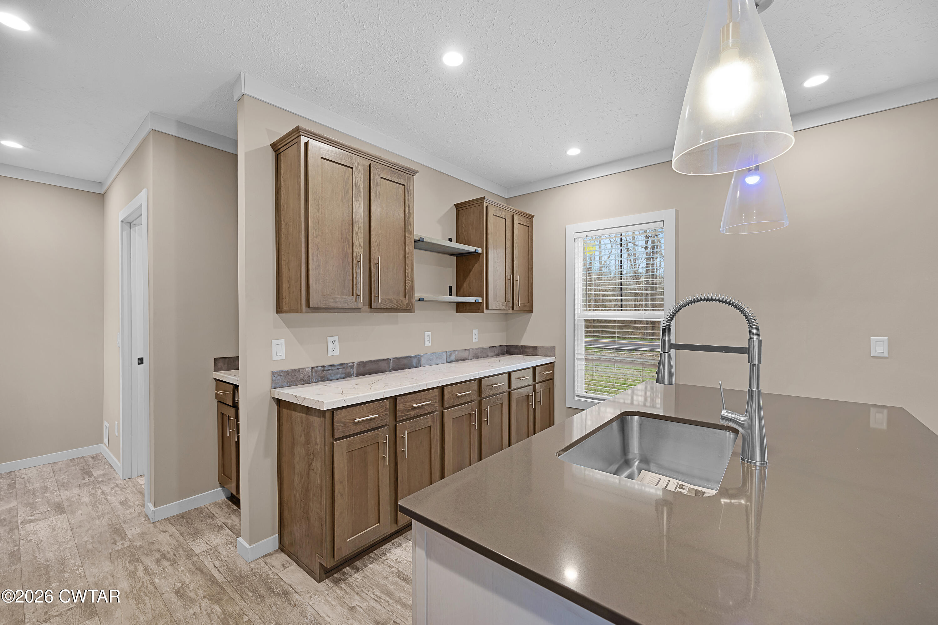 461 Humboldt Gibson Wells Road Humboldt, TN 38343 - Photo 5 of 24 a kitchen with stainless steel appliances granite countertop a sink a stove and a refrigerator