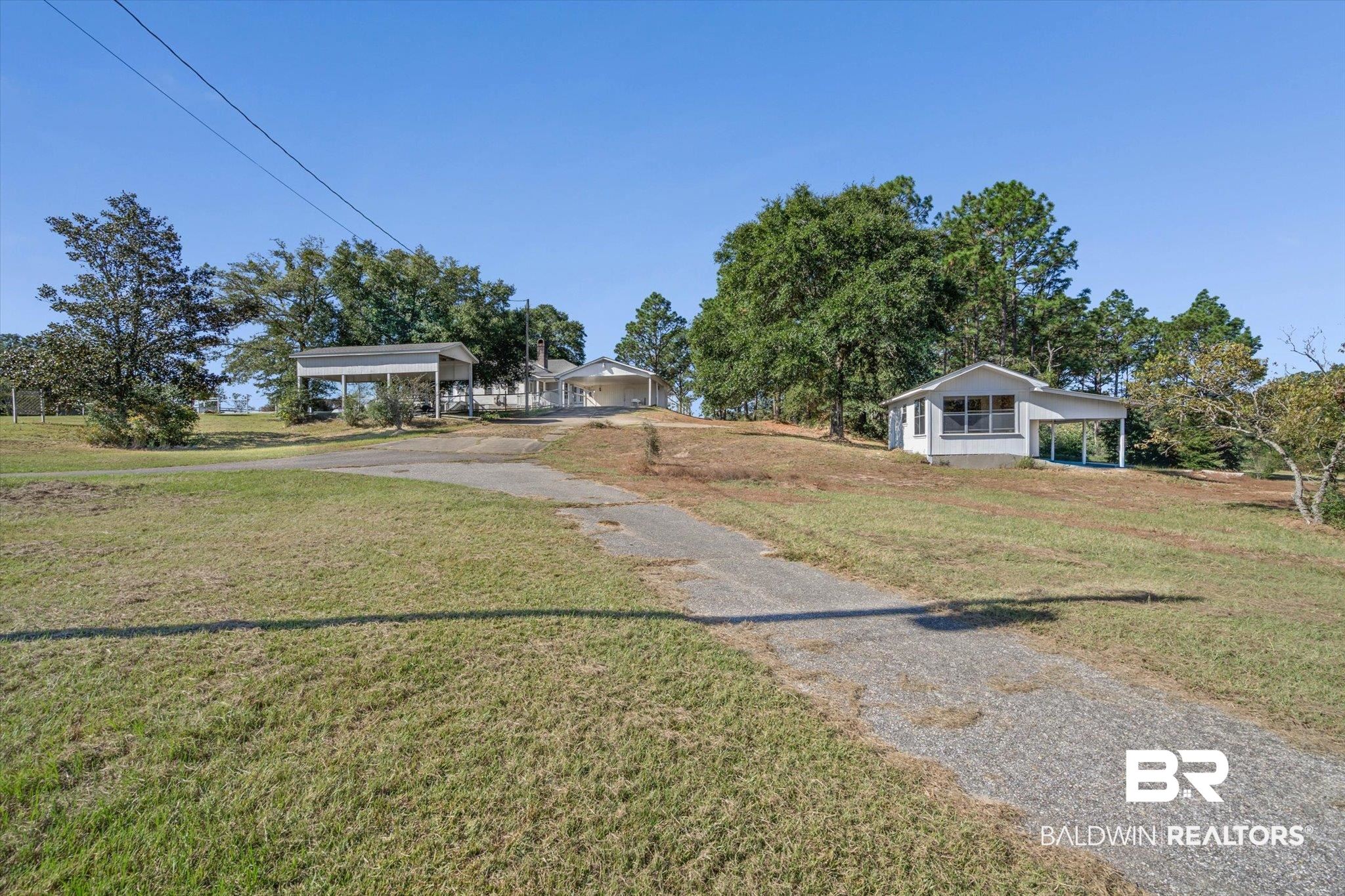 7650 Iron Rush Road Wilmer, AL 36587 - Photo 27 of 34 View of front of home with driveway, a front yard, and a carport