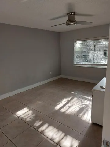a view of lot of window and chandelier