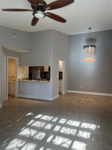 a view of a kitchen with a sink and cabinets
