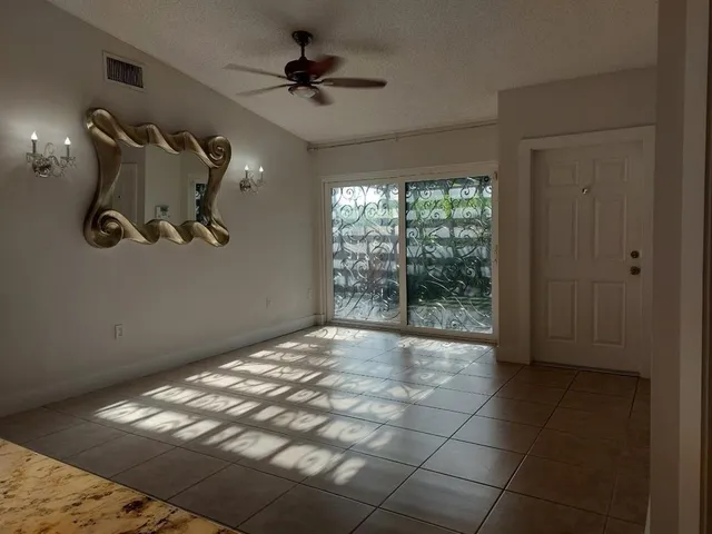 a view of empty room with windows