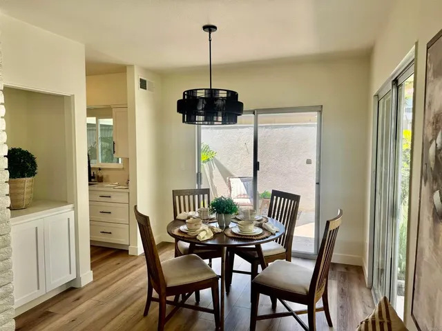a view of a dining room with furniture window and outside view