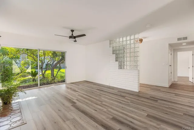 a view of a livingroom with furniture and a table