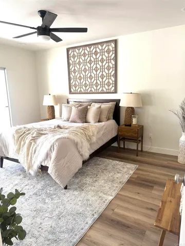 a bedroom with a bed and a chair