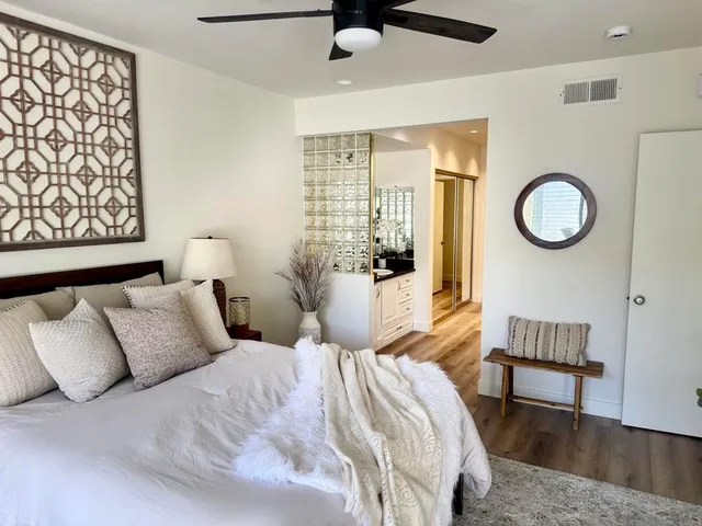 a bedroom with a bed and window