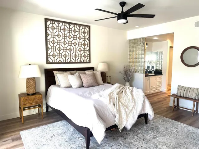 a view of a bedroom with furniture and entryway