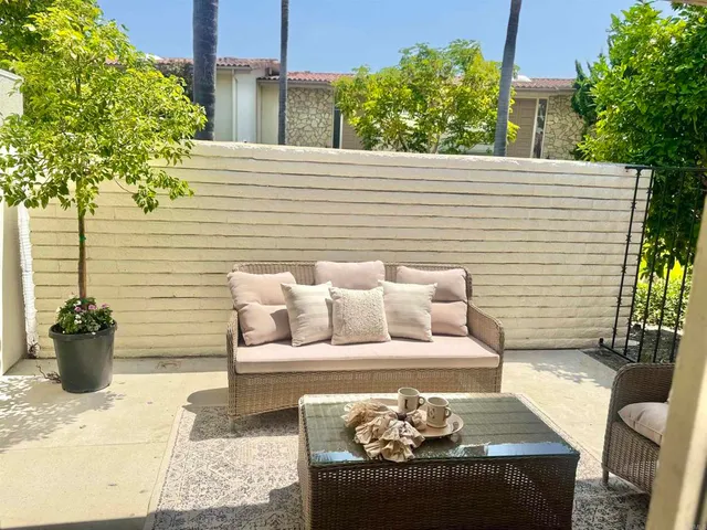 a view of a house with a potted plant