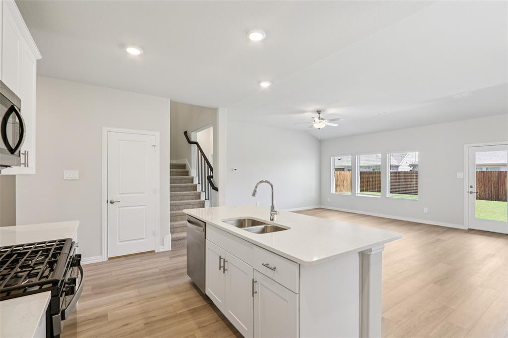 2709 Grand Cyn Street Anna, TX 75409 - Photo 16 of 40 a kitchen with sink and cabinets