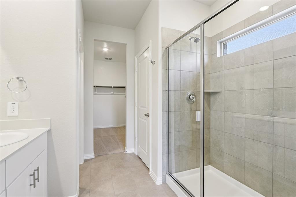 2709 Grand Cyn Street Anna, TX 75409 - Photo 24 of 40 a bathroom with a shower and a sink