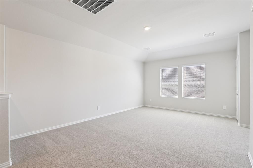 2709 Grand Cyn Street Anna, TX 75409 - Photo 27 of 40 an empty room with windows