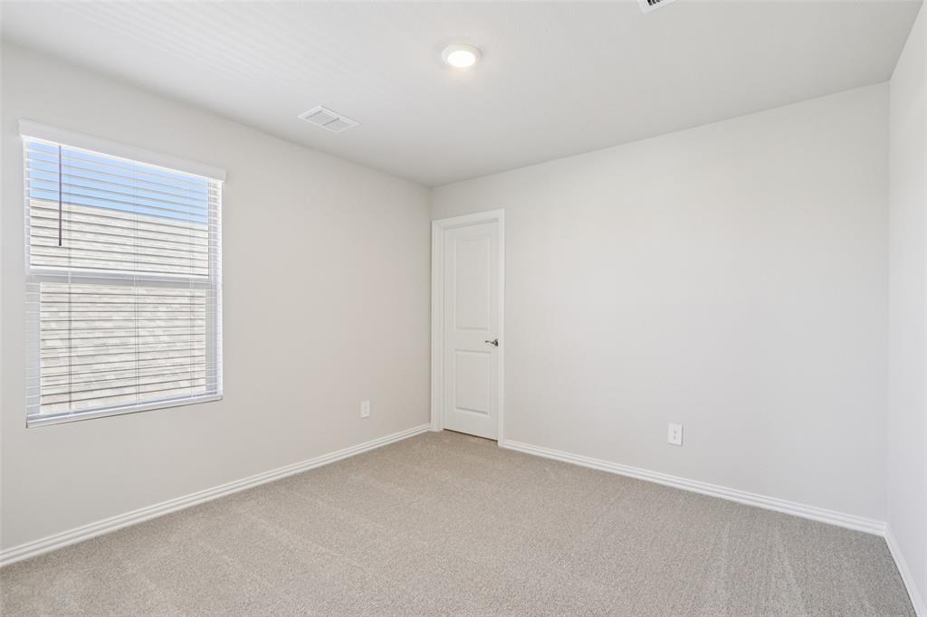 2709 Grand Cyn Street Anna, TX 75409 - Photo 36 of 40 an empty room with a window