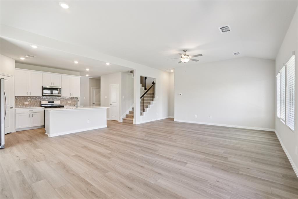 2709 Grand Cyn Street Anna, TX 75409 - Photo 6 of 40 a view of kitchen with wooden floor and electronic appliances