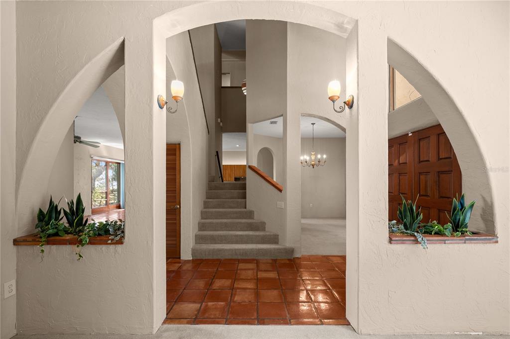 12621 Southeast Sunset Harbor Road Weirsdale, FL 32195 - Photo 25 of 54 a view of a hallway with wooden floor and entryway