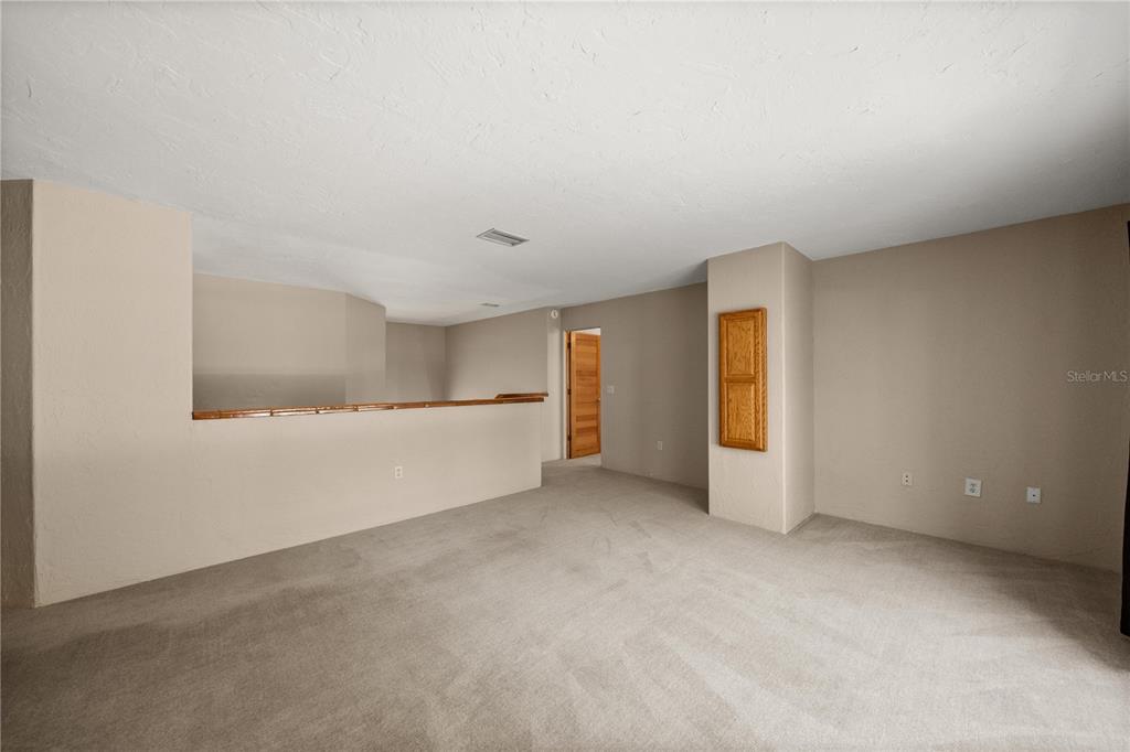 12621 Southeast Sunset Harbor Road Weirsdale, FL 32195 - Photo 26 of 54 a view of an empty room and window