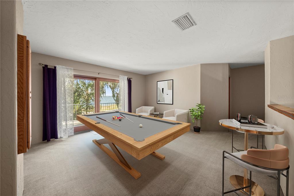 12621 Southeast Sunset Harbor Road Weirsdale, FL 32195 - Photo 32 of 54 a room with pool table and windows