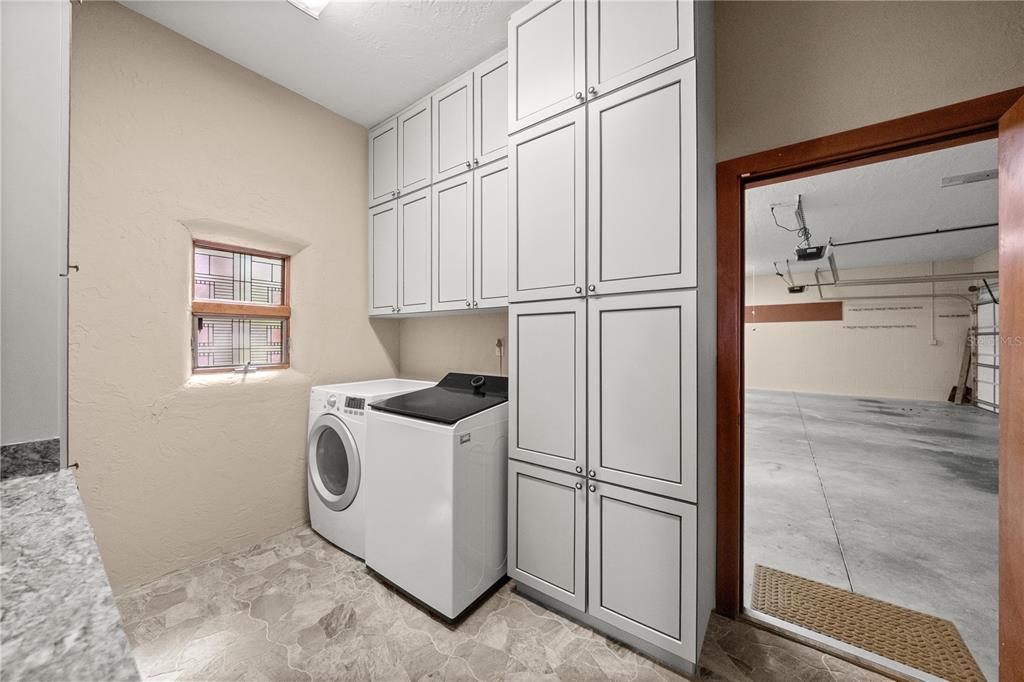 12621 Southeast Sunset Harbor Road Weirsdale, FL 32195 - Photo 38 of 54 a utility room with closet dryer and washer