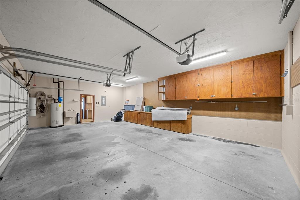 12621 Southeast Sunset Harbor Road Weirsdale, FL 32195 - Photo 40 of 54 a view of a garage with furniture