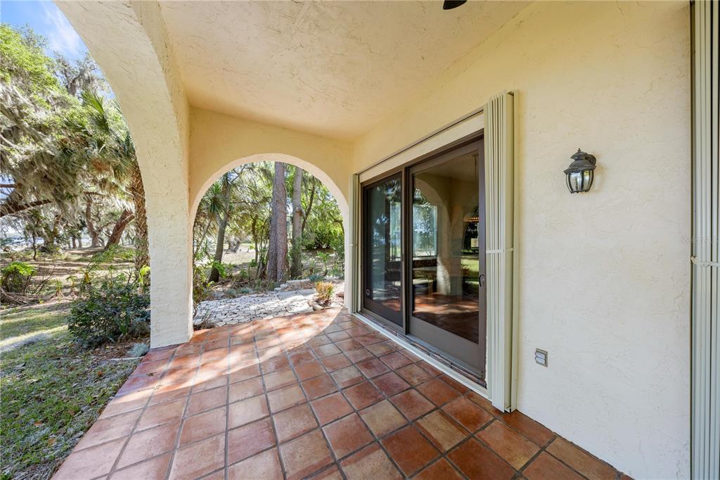 12621 Southeast Sunset Harbor Road Weirsdale, FL 32195 - Photo 47 of 54 a view of a entryway door front of house