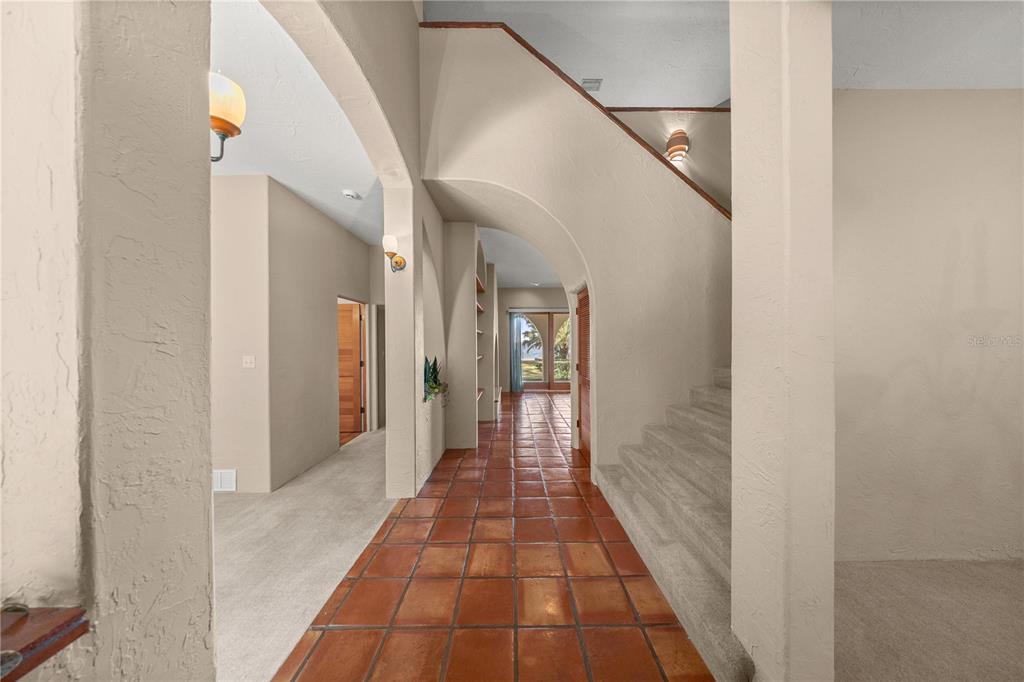12621 Southeast Sunset Harbor Road Weirsdale, FL 32195 - Photo 7 of 54 a view of a hallway with a white walls