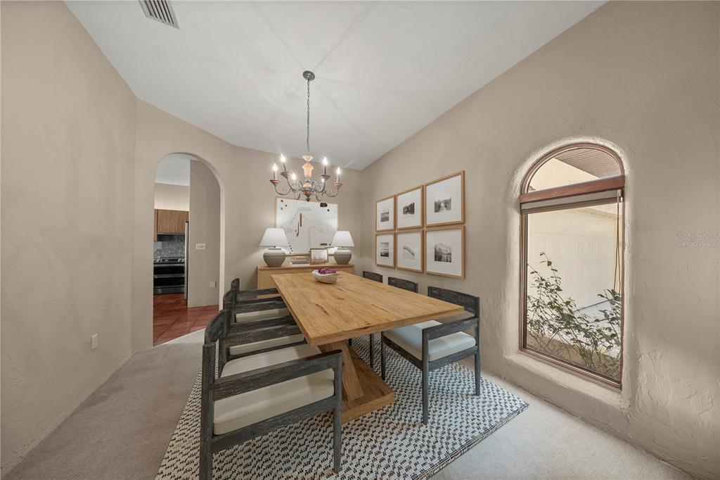 12621 Southeast Sunset Harbor Road Weirsdale, FL 32195 - Photo 8 of 54 a view of a livingroom with furniture window and wooden floor
