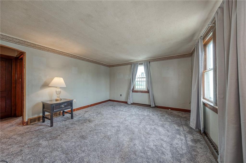 1070 Maple Avenue Washington, PA 15301 - Photo 6 of 28 a view of a livingroom with a chair and a large window