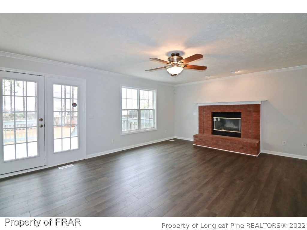 45 Chesapeake Road Cameron, NC 28326 - Photo 17 of 35 an empty room with wooden floor and window
