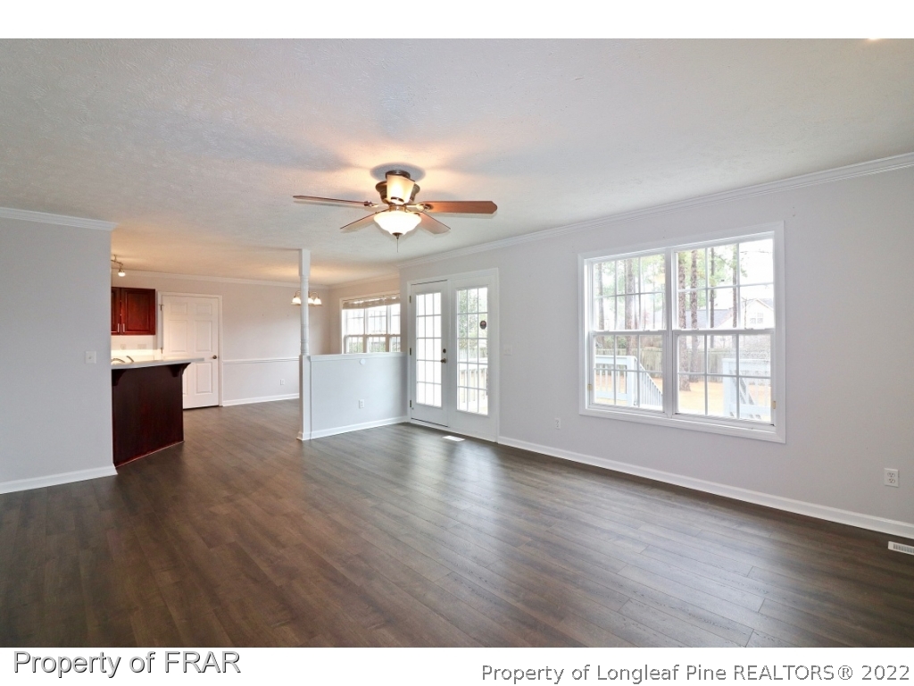 45 Chesapeake Road Cameron, NC 28326 - Photo 19 of 35 a view of an empty room with a window and wooden floor