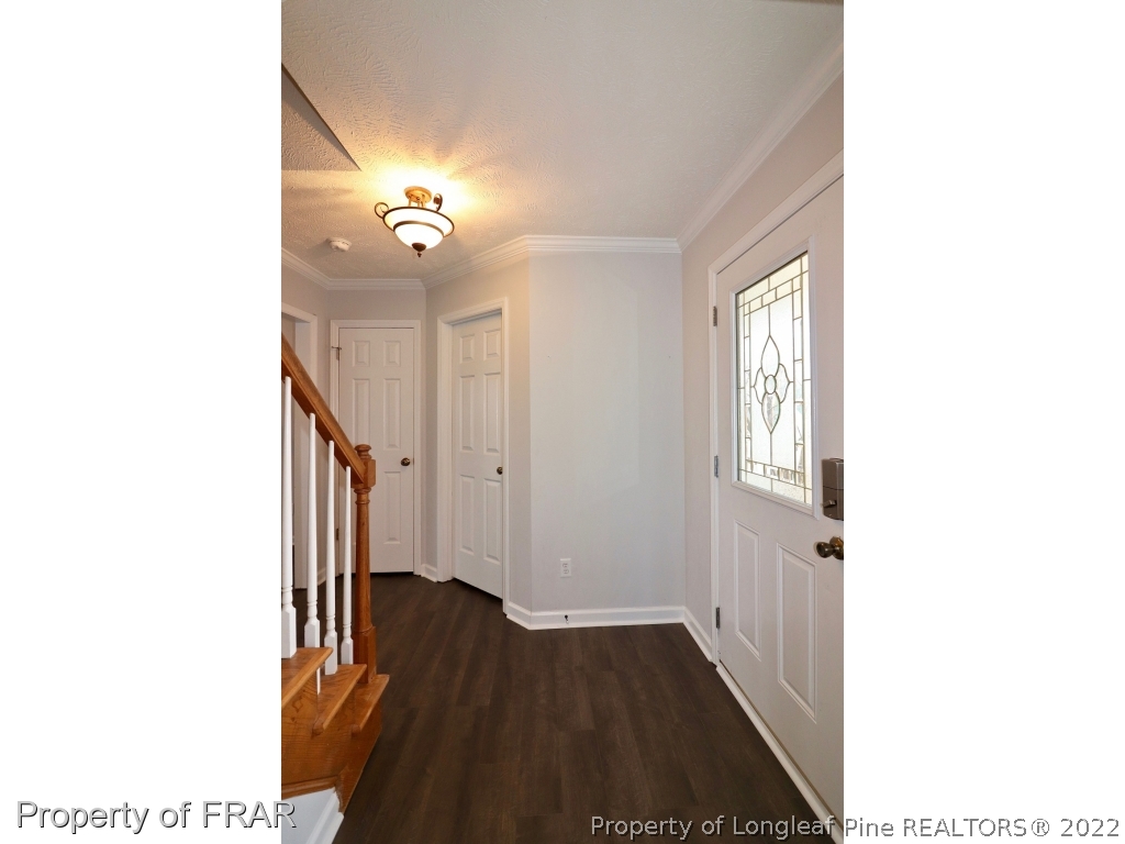 45 Chesapeake Road Cameron, NC 28326 - Photo 2 of 35 a view of a hallway with wooden floor and staircase
