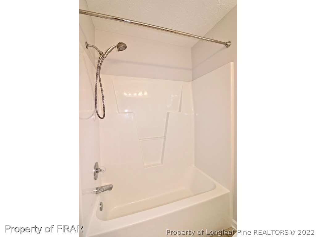 45 Chesapeake Road Cameron, NC 28326 - Photo 23 of 35 a bath tub sitting next to a white sink