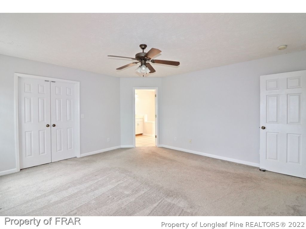 45 Chesapeake Road Cameron, NC 28326 - Photo 28 of 35 a view of an empty room with a ceiling fan and a window