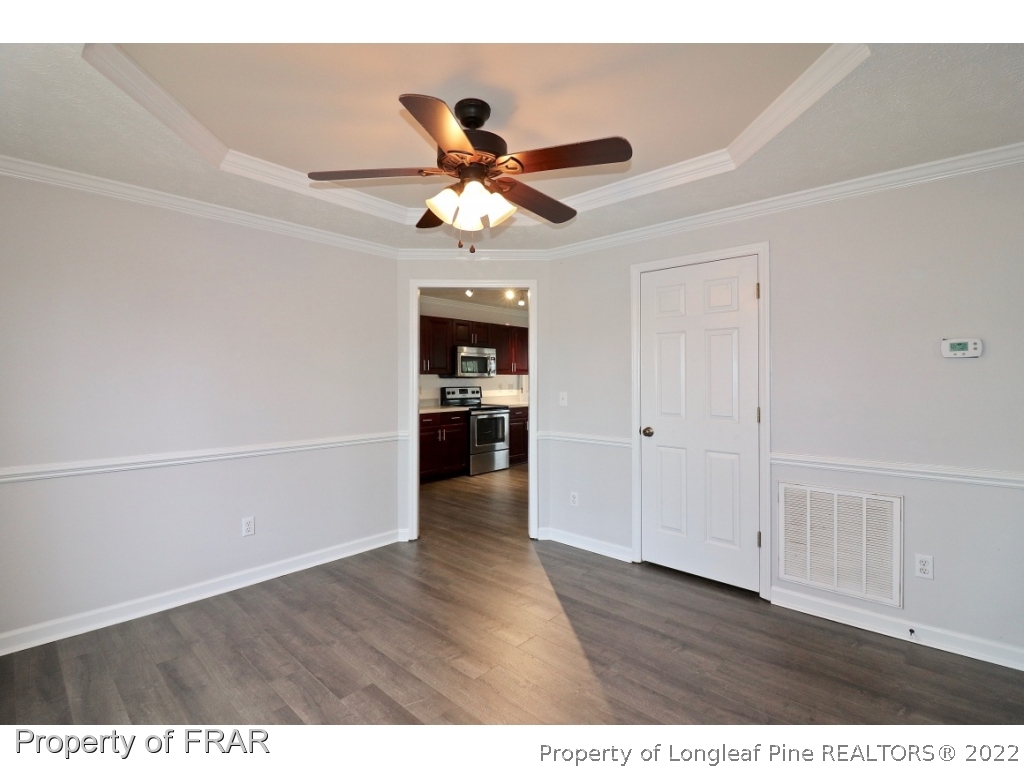45 Chesapeake Road Cameron, NC 28326 - Photo 4 of 35 a view of empty room with wooden floor and fan