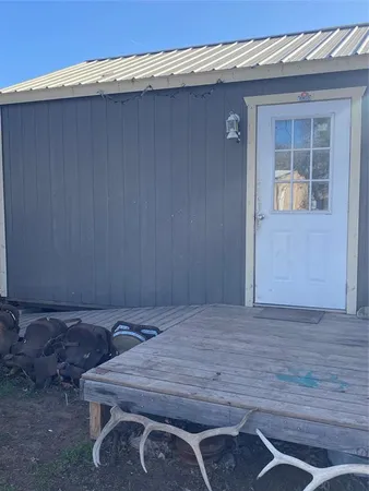 a wooden door in front of a house