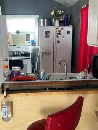 a room with furniture and a flat screen tv
