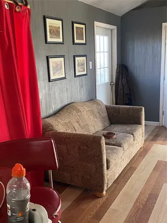 a living room with a couch and a window