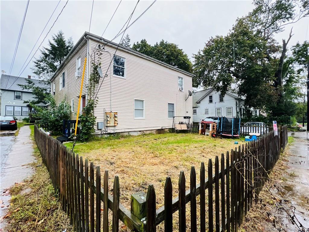22 Spring Street Killingly, CT 06239 - Photo 1 of 1 a view of house with backyard and sitting area