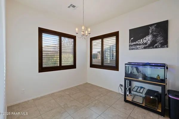 a large kitchen with stainless steel appliances granite countertop a refrigerator and a stove top oven
