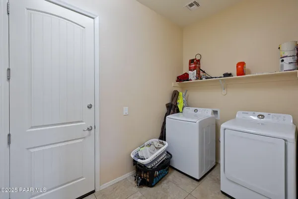 a room with gym equipment and a window