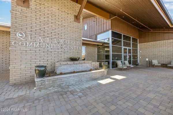 a room with lots of flower chair and wooden floor