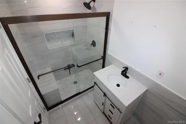 a bathroom with a sink and mirror