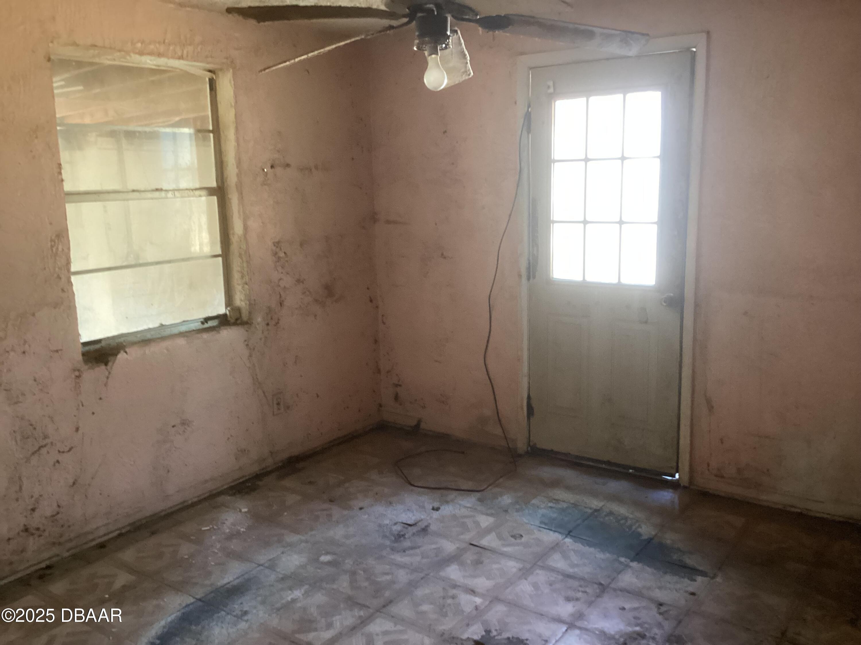 142 Holland Road Ormond Beach, FL 32176 - Photo 15 of 15 an empty room with a window